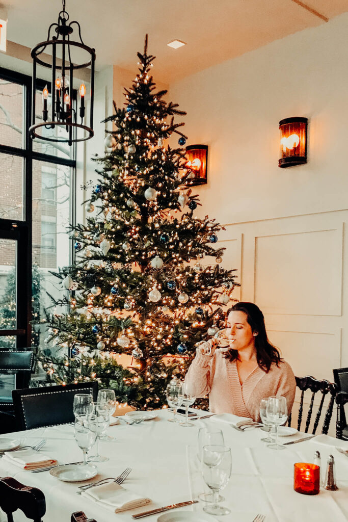 Sipping wine by a Christmas tree in Chicago, Illinois